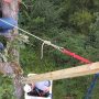 Hauling the beam up into place after John attached it. We set up a pulley system in the tree that could be locked in place to hold the beam until we were ready to release it.